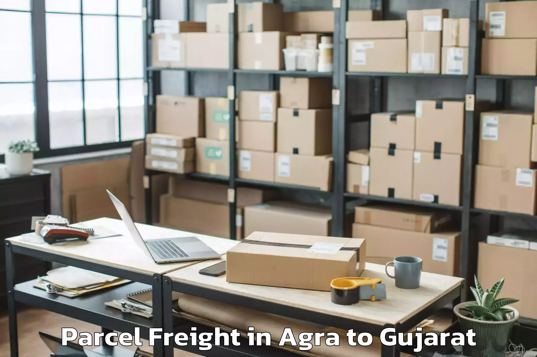 Discover Agra to Modasa Parcel Freight